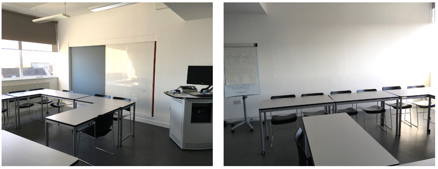 Chairs and tables in small groups around the room. The room has whiteboards fixed to the walls.